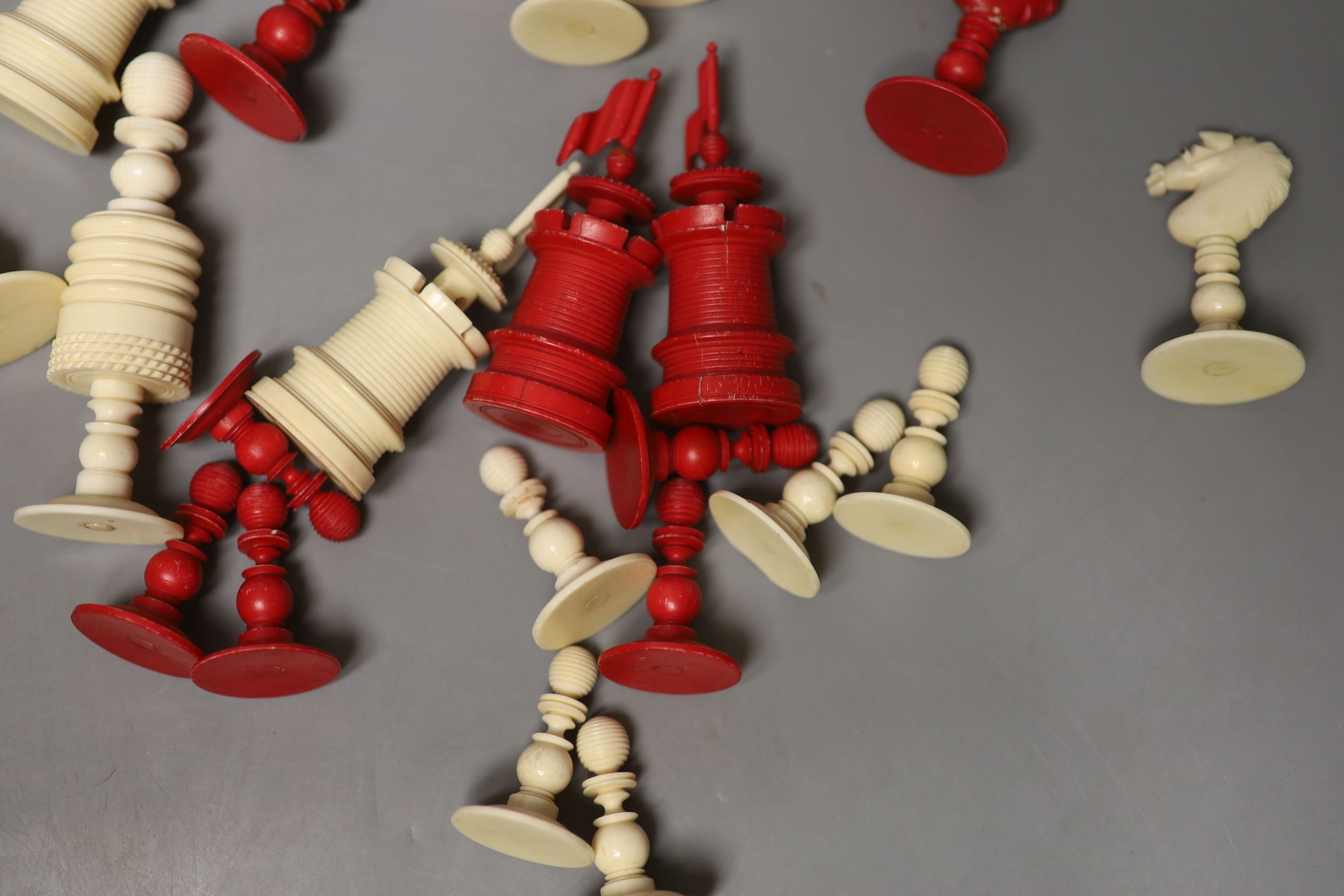 A 19th century natural and red stained bone chess set